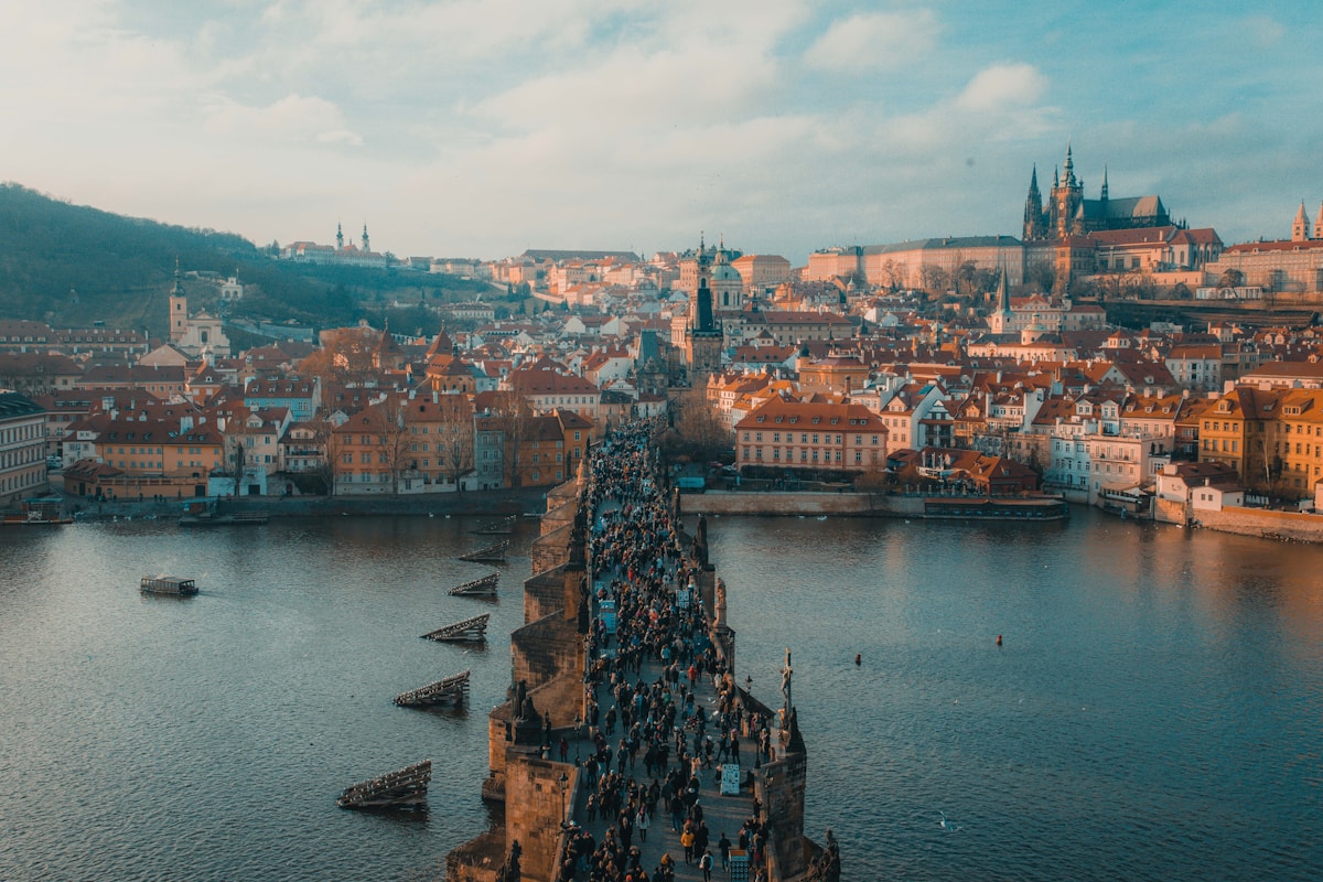 Charles Bridge with baroque statues and Prague Castle in background